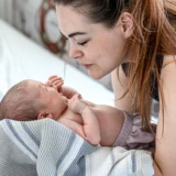 Postpartum Doulas Are Part of the 2026 Baby Trend Report — Here’s What They Do and How to Find One